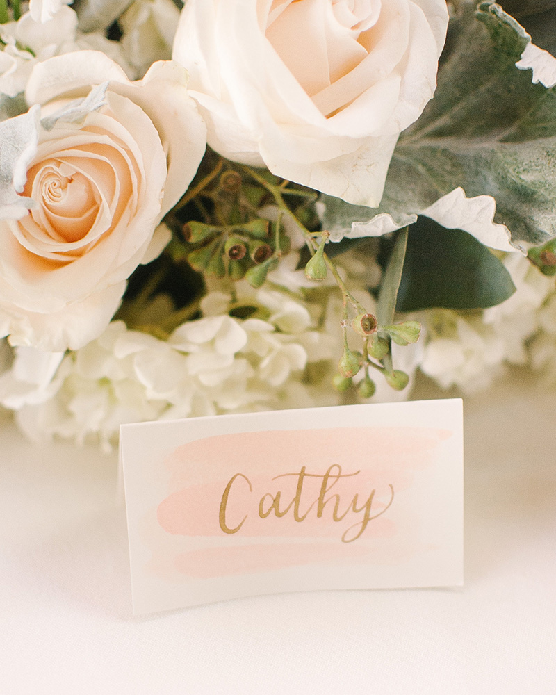 watercolor wash place cards with gold calligraphy